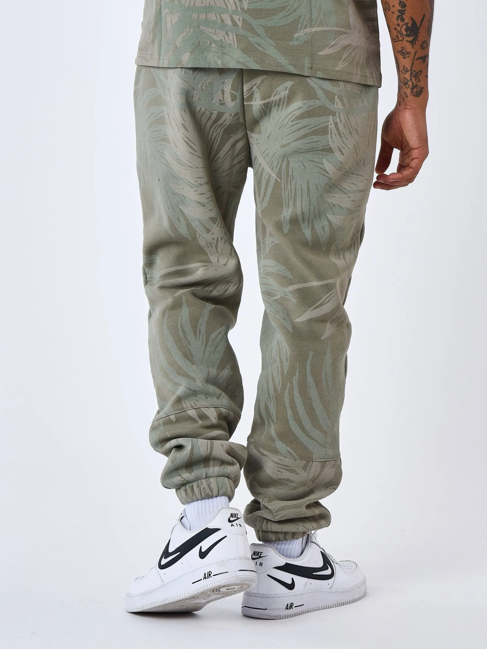 Pantalón de chándal con estampado integral de hojas de palmera
