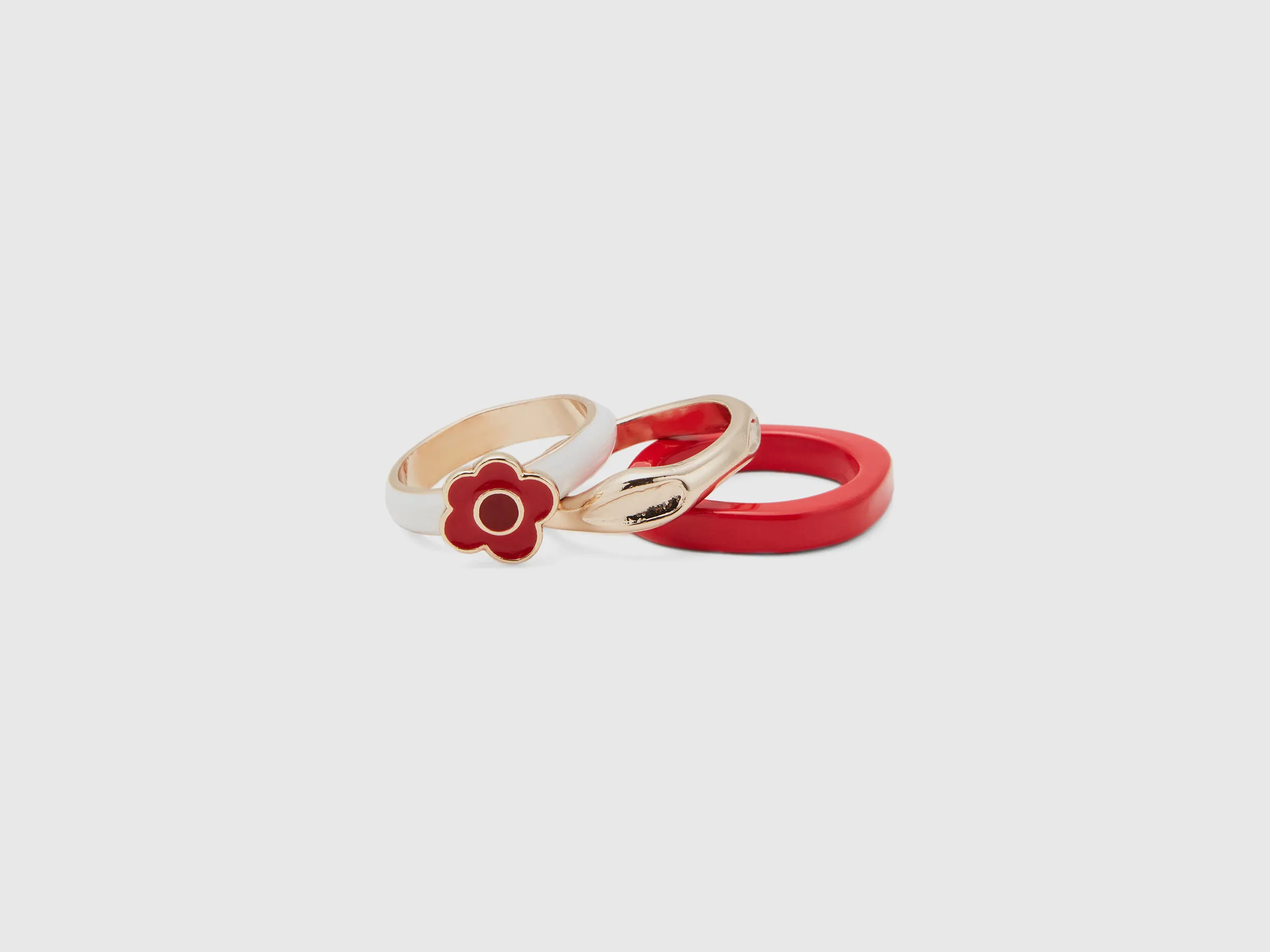 Tres anillo rojo, dorado y blanco