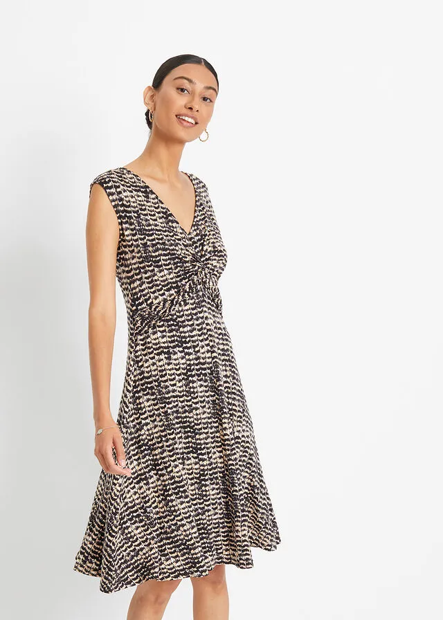 VESTIDO DE PUNTO BEIGENEGRO CON ESTAMPADO DE CEBRA